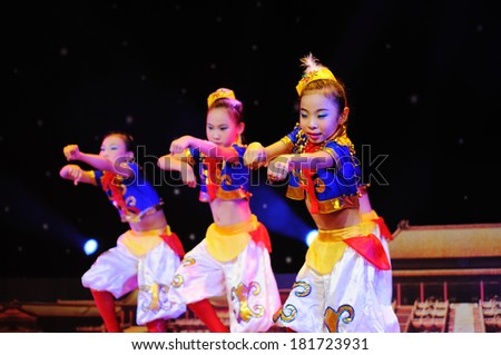 SHIJIAZHUANG CITY, CHINA - JULY 2012: On July 7, 2012 in Shijiazhuang City, China Youth Arts Festival. Unidentified group of cute kids performing unrestrained, happy Mongolian dance.
