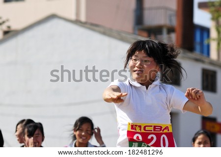 Xingtai City, China - May 12: In May 12, 2011, baixiang County Middle School Games were held. Unidentified student athletes in the throwing game and worked hard to win.