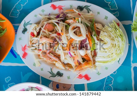 papaya salad with seafood, thai popular food and spicy taste