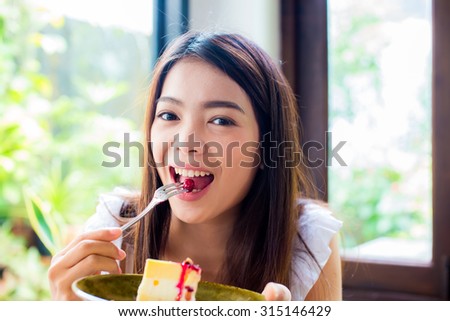 thai girl eat cake