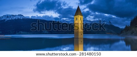 panoramic view to flooded church in the lake in Italy