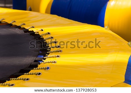 Part of yellow blue strip trampoline