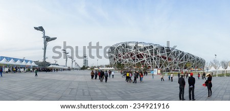 CHINA - APRIL 11: panorama of Tourist walking around Bird Nest China National Olympic Stadium in Beijing,China, 11 April 2012