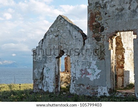 ruin of an abandoned house next to the straits of gibraltar