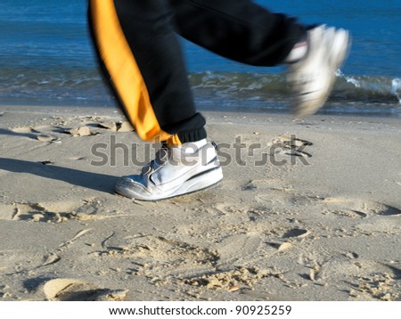 jogging on the beach, closeup of feet
