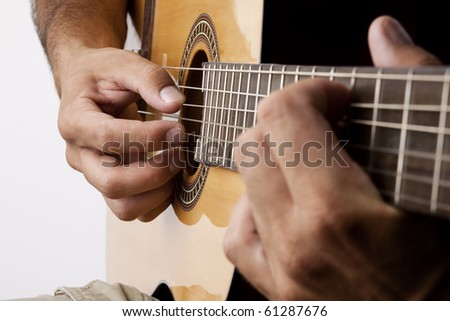Man playing the guitar, studio shot taken in Vienna.