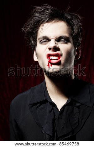 Angry beautiful male vampire