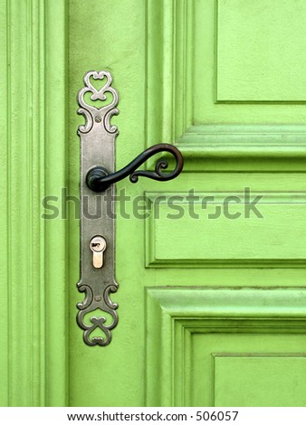 light green door with metal handle