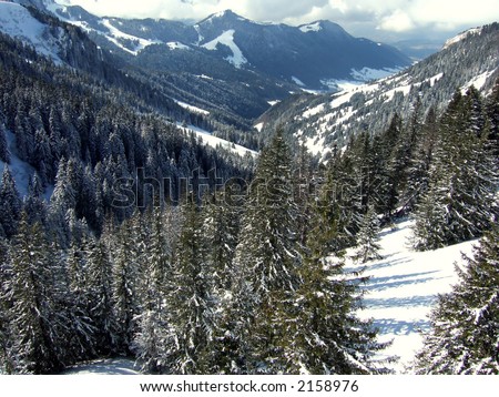 sunny landscape valley with trees and far mountains - sky view