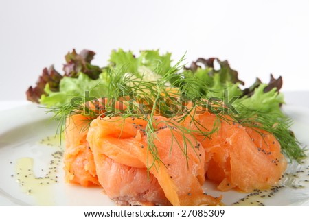 A delicious smoked salmon with dill and lettuce