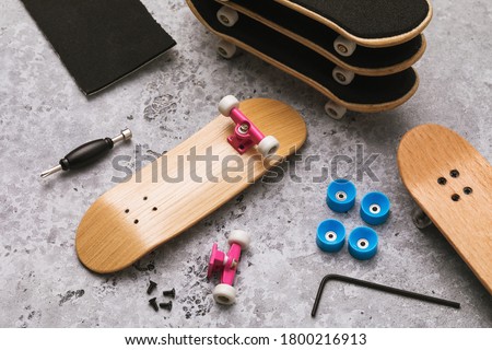 Disassembled fingerboard and various accessories on the table with repair tools Stock foto © 