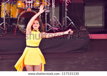 ISTANBUL - APRIL 22: Singer Atiye performs for the children during National Sovereignty and Children Day on April 22, 2012 in Istanbul. Children\'s Festival was first celebrated in Turkey on 1920.