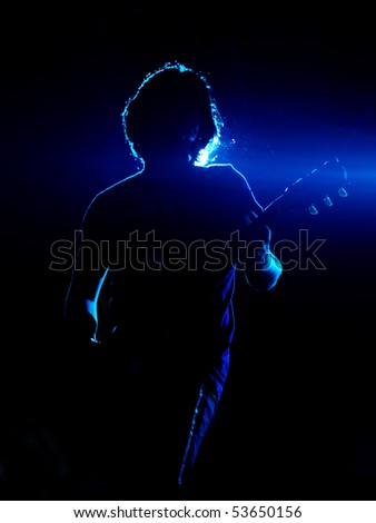 ISTANBUL - MAY 14: Band Mor ve Otesi performs live at Maltepe open air stage on May 14, 2010 in Istanbul, Turkey. Guitarist Kerem ?zyegen of the rock group plays