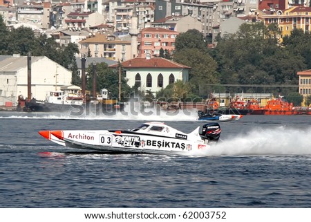 ISTANBUL - SEPTEMBER 25: Racing boat speeds along the water at World Offshore Championship, September 25, 2010 in Istanbul, Turkey. The pilots Ali TANIR and Murat LEKI drive for the BESIKTAS team