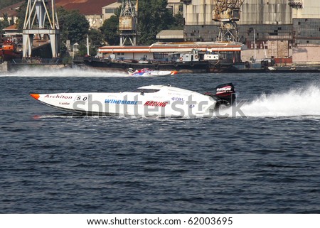 ISTANBUL - SEPTEMBER 25: An Off-Shore racing boat speeds along the water at the UIM World Offshore 225 Championship, September 25, 2010 on the Golden-Horn bay in Istanbul. Windmare Racing team runs