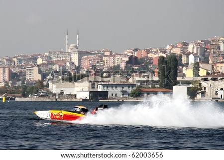 ISTANBUL - SEPTEMBER 25: An Off-Shore racing boat speeds along the water at World Offshore Championship, September 25, 2010 in Istanbul. Berna and Josef MUHLBAUER drive for the GALATASARAY team