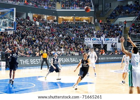 ISTANBUL - JANUARY 20: Marco Carraretto (9) takes a three point shot at THY Euroleage Top 16 Championship basketball game, Efes Pilsen vs Montepaschi Siena January 20, 2011 in Istanbul, Turkey