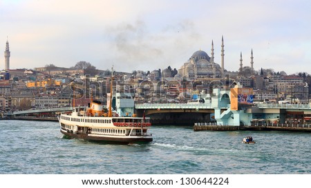 ISTANBUL - DEC 31: Historical Galata Bridge looking to Eminonu on December 31, 2012 in Istanbul. It is a bascule bridge which is 490 m long and connects Karakoy Region to Old City.