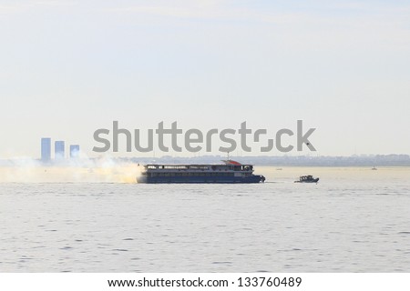 ISTANBUL - APR 2: Passenger ship SABRET caught fire while off the Prince Islands coasts on April 2, 2013 in Istanbul. About 230 people rescued from burning tour boat by another coming from Bostanci.