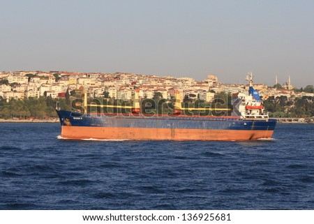 ISTANBUL - APR 29: General cargo ship GHADA D (IMO: 7715989, Moldova) sails along Bosporus on April 29, 2013 in Istanbul. A 80 mt long, 16 mt width vessel has a deadweight of 3450 tons. Dry cargo ship