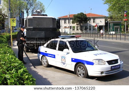 ISTANBUL - MAY 1: Many people can\'t take part in May Day march on May 1, 2013 in Istanbul. Police blocked all the ways to Taksim Square to prevent the activists from joining their mates. Police Car