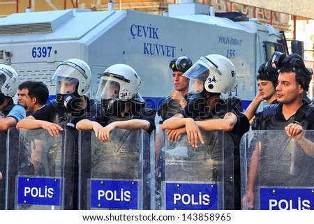 ISTANBUL - JUN 17: Five labor unions call 1-day nationwide strike over crackdown on June 17, 2013 in Istanbul, Turkey. Police lined up on Istiklal Street during the protest.