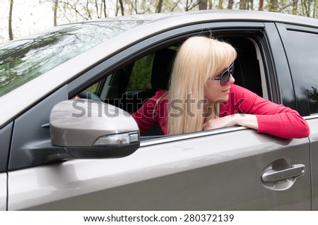 Girl in the car looks back