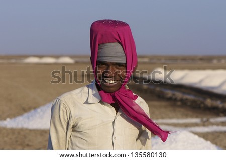 DHRANGADHRA, INDIA - MARCH 13: Unidentified man, salt worker in the Little Rann of Kutch. on March 13, 2012 in Dhrangadhra, India.  India is world\'s 3rd largest producer of salt, 80% from Gujarat.