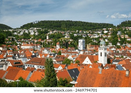 Germany, Albstadt at the Schwaebische Alb skyline of medieval city illuminated by the dawn, aerial view above roofs and houses at sunset