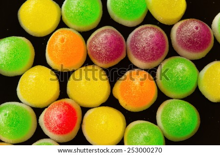 Background of colorful sprinkles, jelly for cake decoration or ice cream topping