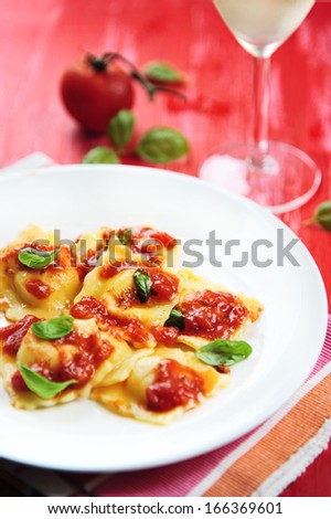 italian homemade ravioli pasta with red tomato sauce