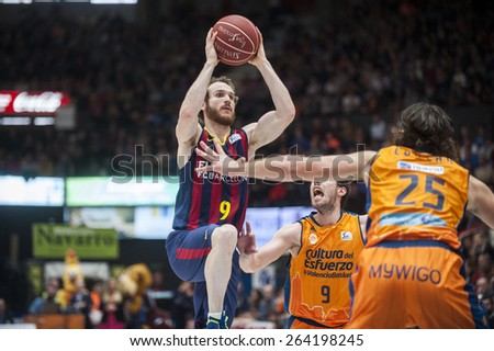 VALENCIA, SPAIN - MARCH 5: Sam Van Brossom, Loncar and M. Huertas during EURO CUP match between Valencia Basket Club and Bascelona F.C. Basket at Fonteta Stadium on March 22, 2015 in Valencia, Spain