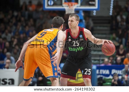 VALENCIA, SPAIN - MARCH 5: Anton Gavel and Sam Van Brossomduring EURO CUP match between Valencia Basket Club and Bayern Munich at Fonteta Stadium on March 5, 2015 in Valencia, Spain