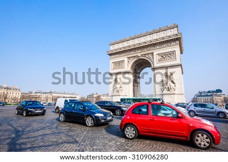 PARIS - MARCH 20: view of the Arc de Triomphe and traffic jam on March 20, 2015 in Paris, France. The Arc de Triomphe is one of the main attractions of Paris with more than 15 million visitors a year.