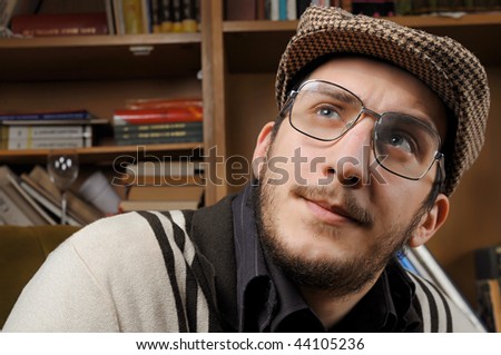 Young man dressed in retro clothes whit sunglasses and hat