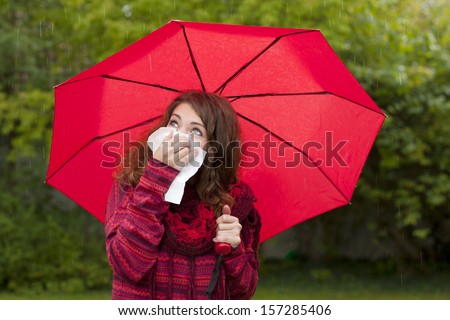 Woman outdoor with cold and handkerchief