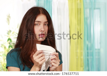 Woman with cold and handkerchief