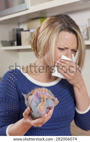 Woman with mite allergy and handkerchief