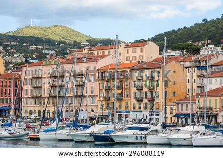 Nice, France - 15th may 2015: Boats docked in front of colourful  buildings of port of Nice in the south of France