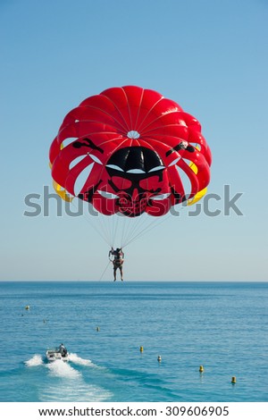 Nice, France - 18th may 2015: man paragliding on the coast of Nice in the south of France on a sunny day