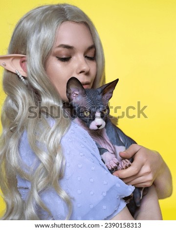 Similar – Image, Stock Photo Sphynx cat on shoulder of owner