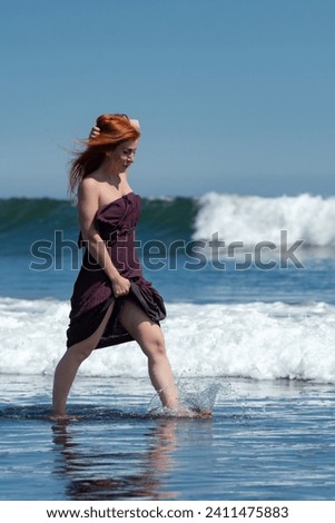 Similar – Image, Stock Photo Cheerful barefoot ginger woman waking up on bed