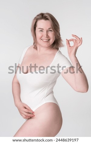 Similar – Image, Stock Photo Curvy woman in bodysuit lying on bed