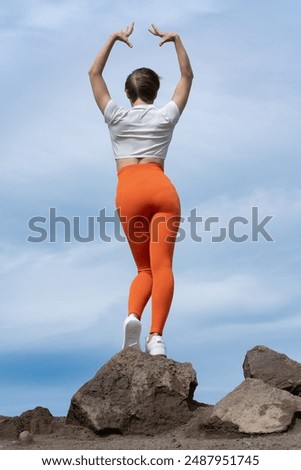 Similar – Image, Stock Photo Anonymous sportswoman practicing yoga on street