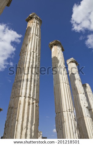 Long greek columns on a blue sky in Aphrodisias, old city in Turkey. Heritage architecture.