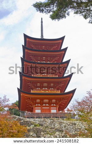 Red Japanese pagoda building. Nippon Shinto wood old religious traditional house.