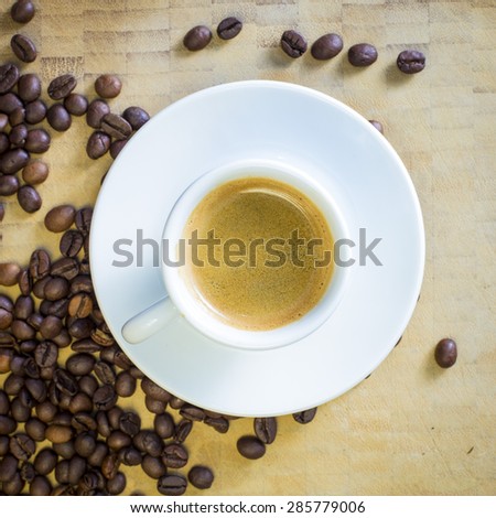 Coffee espresso white dish and many beans