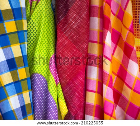 Clothes in scott pattern and dot pattern in fabric shops.