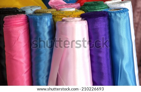Roll of Silk Fabric display in fabric shops.