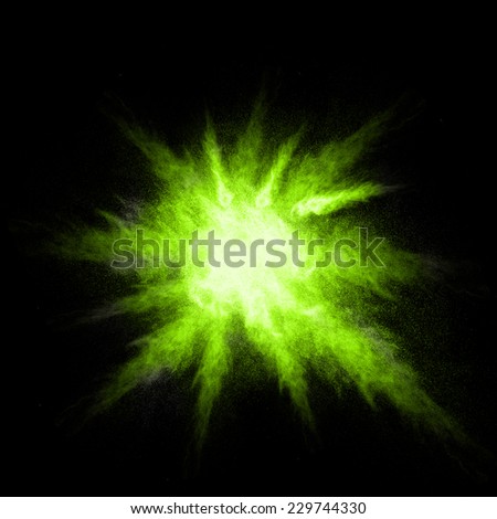 Stop motion of green dust explosion isolated on black background